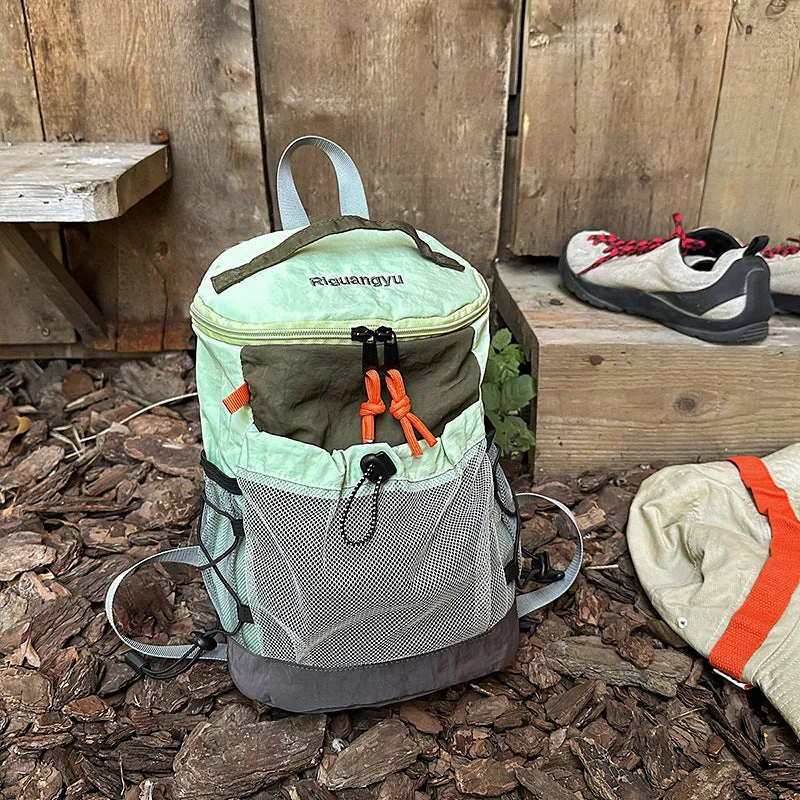 Waterproof nylon casual backpack in solid colour with curved shoulder straps and fold design details