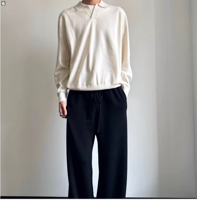 Pure wool polo sweater with a lapel collar in navy blue, shown in a loose fit on a model.