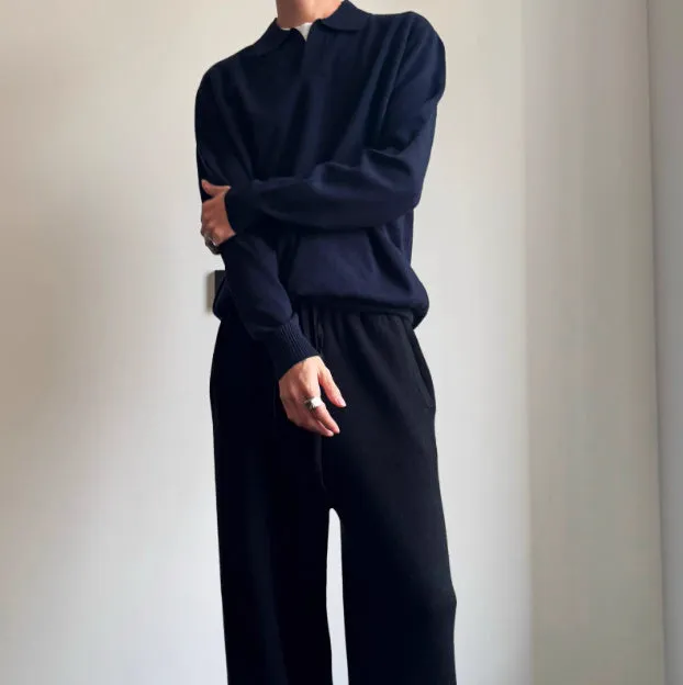 Pure wool polo sweater with a lapel collar in navy blue, shown in a loose fit on a model.