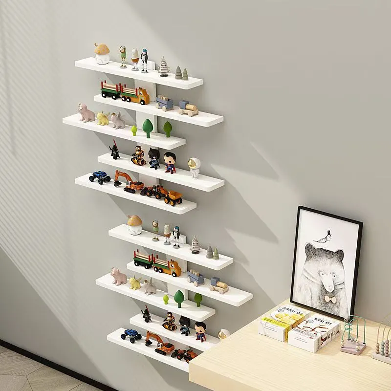 White 5-tier PVC wall-mounted rack displaying toy dolls and blind boxes.