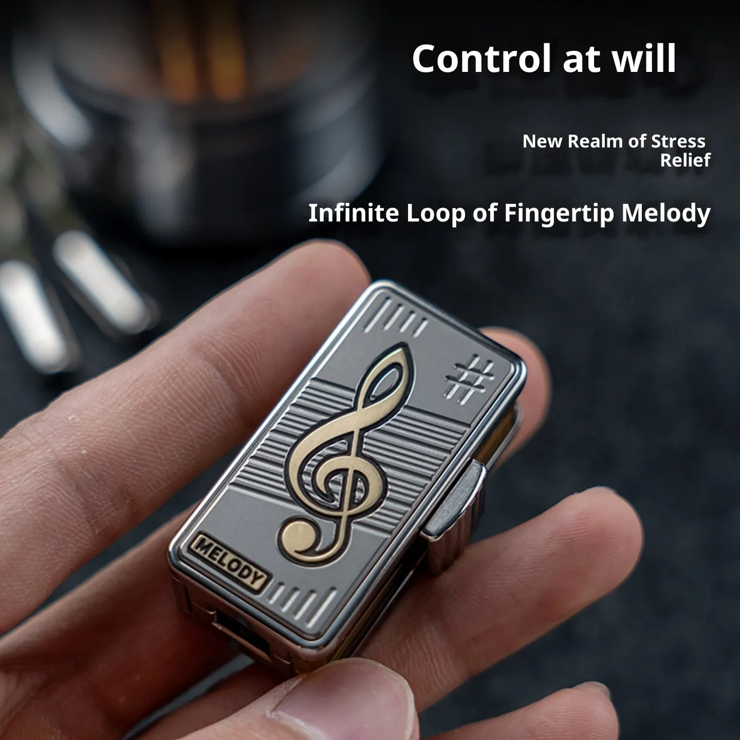 Titanium alloy mechanical scale push EDC fingertip decompression toy in Melody colour shown on a desk