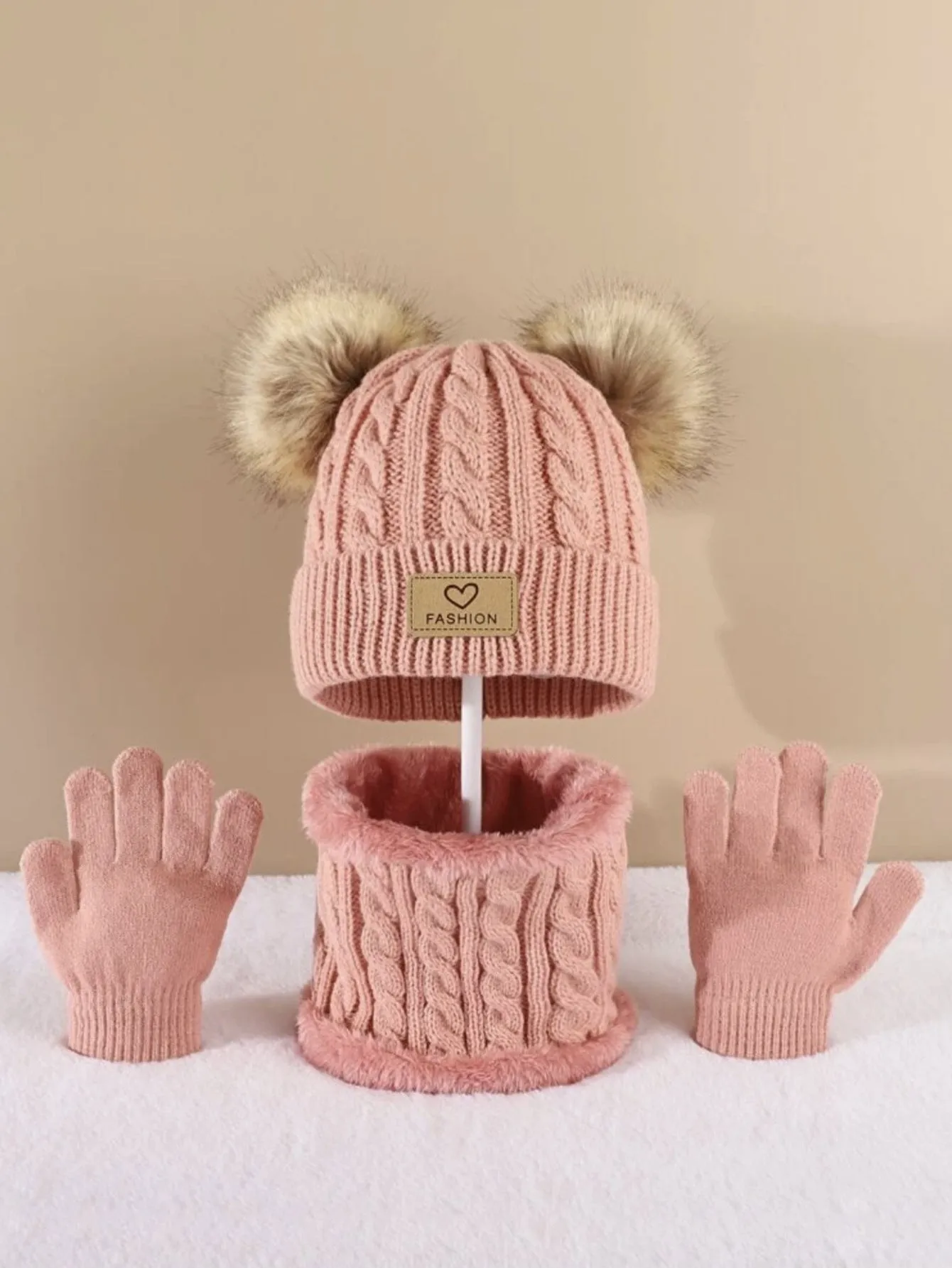 Children's three-piece acrylic knit winter set with dome crown hat and matching scarf and gloves in pink