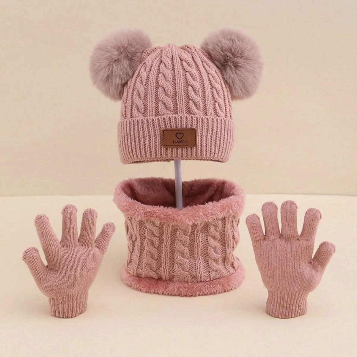 Children's three-piece acrylic knit winter set with dome crown hat and matching scarf and gloves in pink