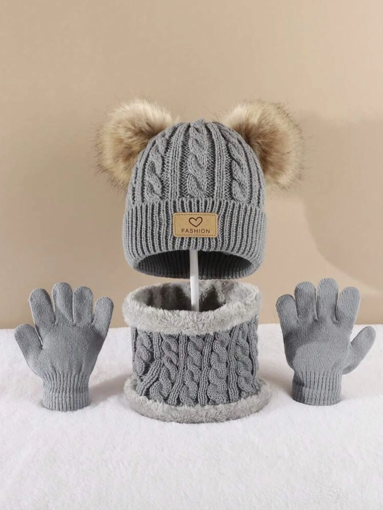 Children's three-piece acrylic knit winter set with dome crown hat and matching scarf and gloves in pink
