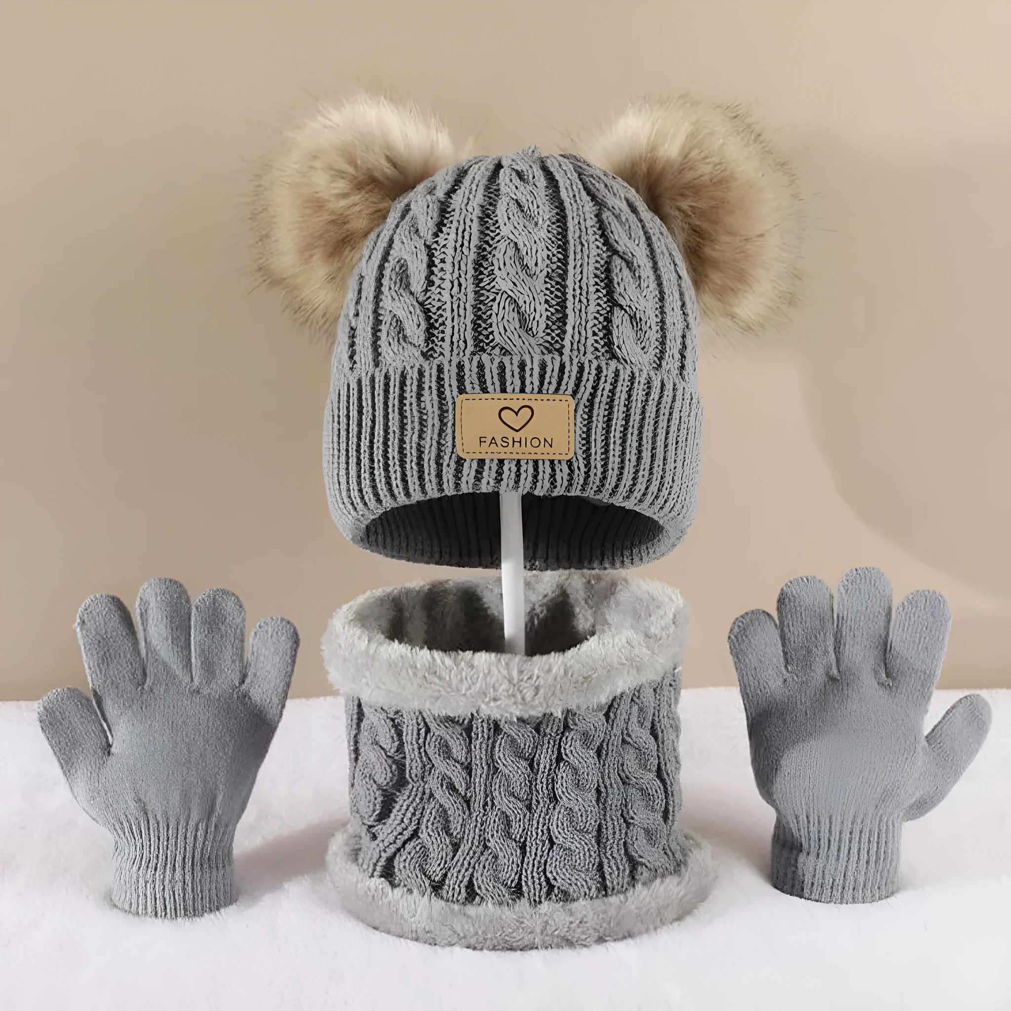 Children's three-piece acrylic knit winter set with dome crown hat and matching scarf and gloves in pink