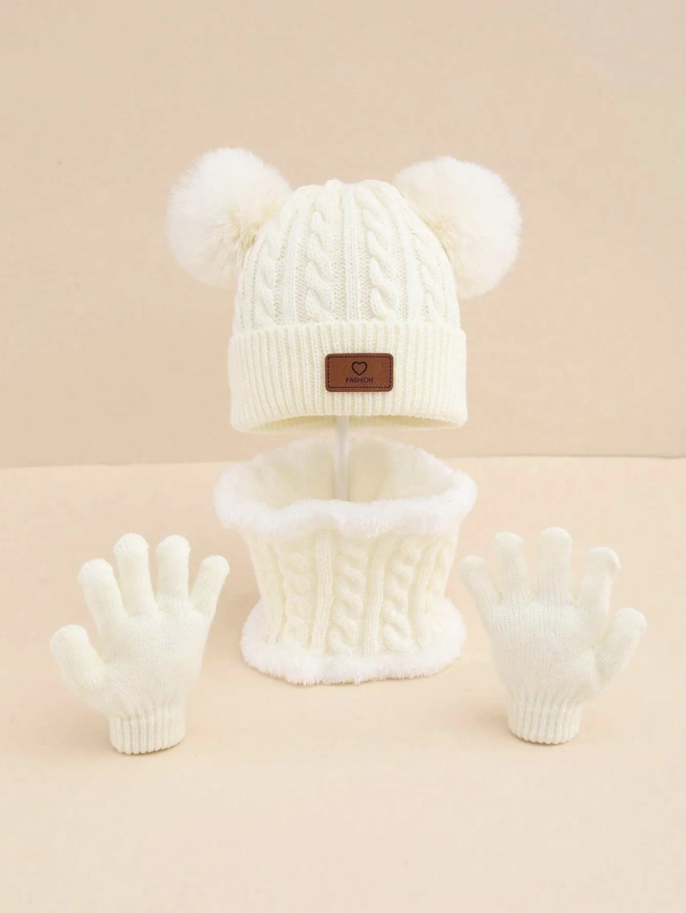 Children's three-piece acrylic knit winter set with dome crown hat and matching scarf and gloves in pink