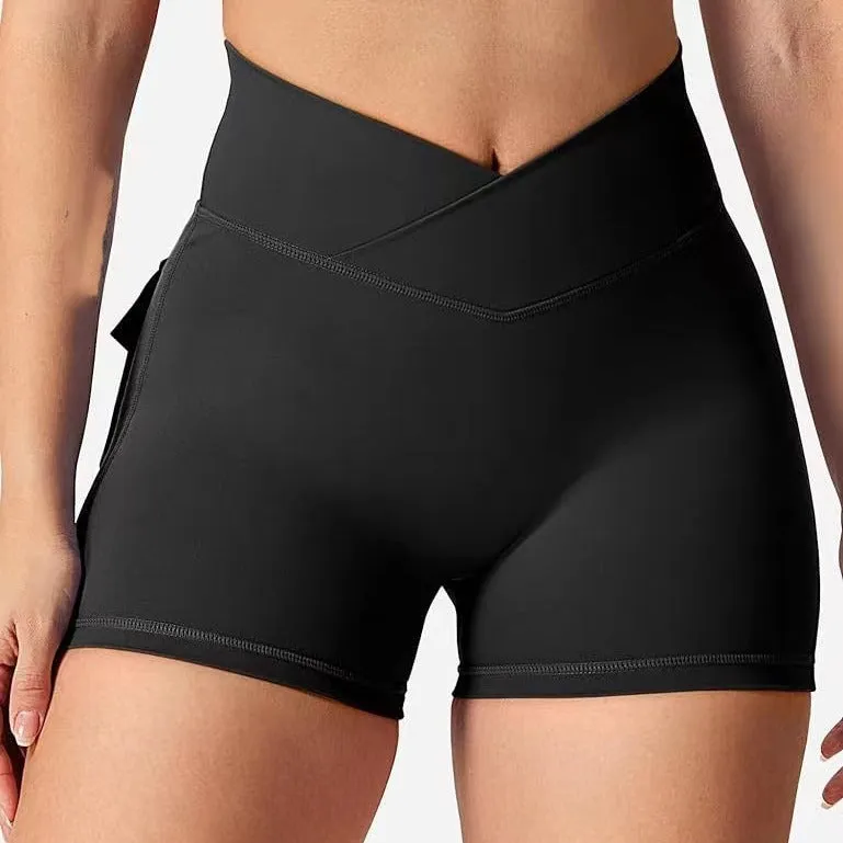 Women's peach hip-tight workout shorts in chemical fibre blend fabric for fitness activities