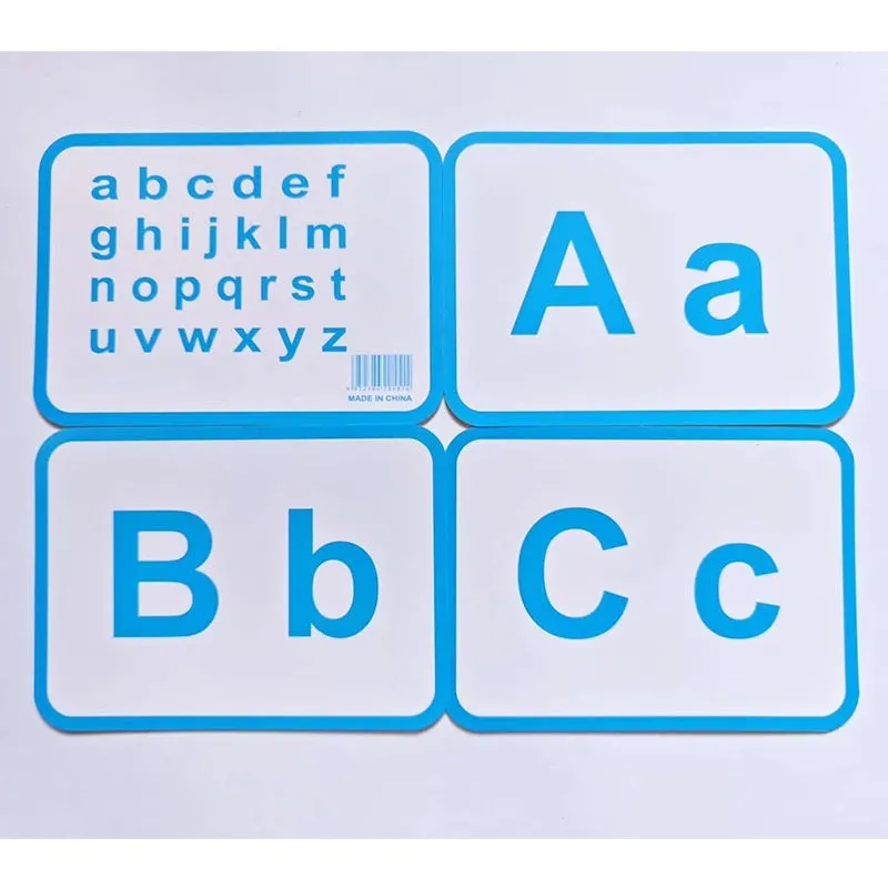 28 paper children's recognition literacy cards covering English and number learning laid out on a flat surface