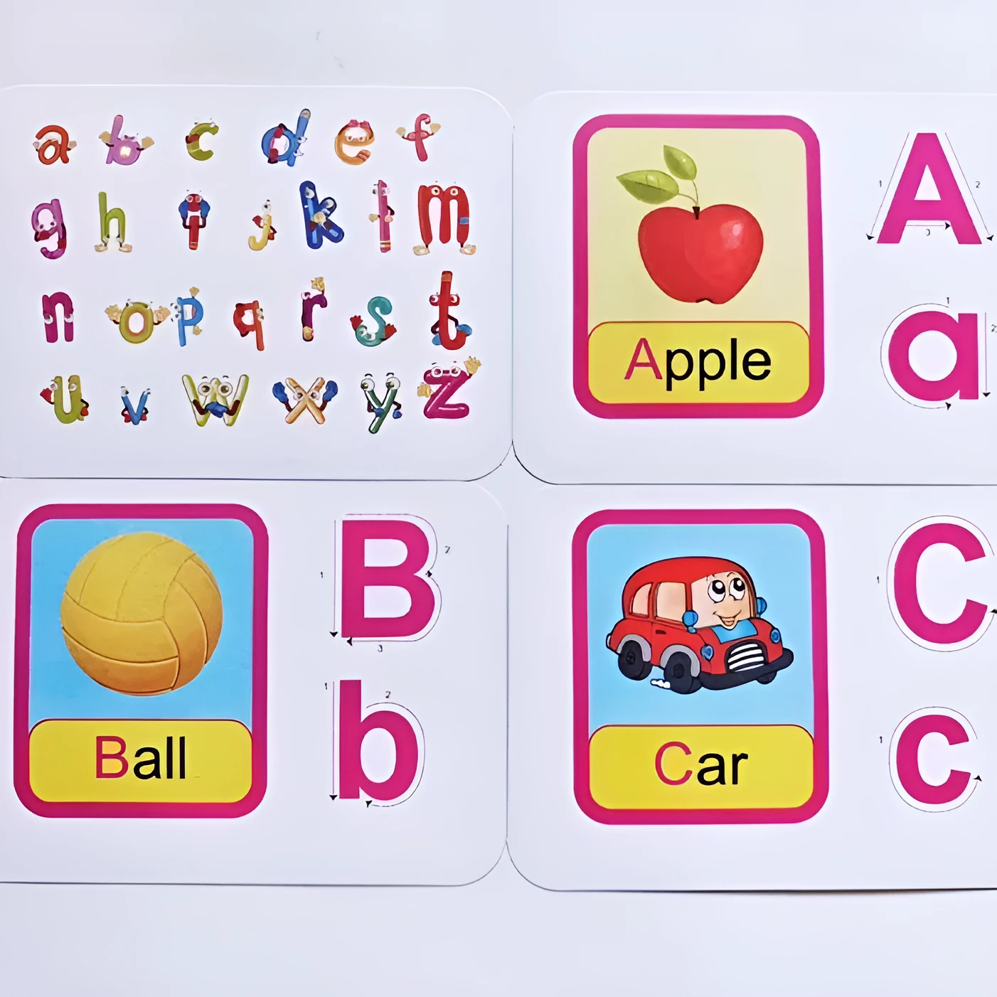 28 paper children's recognition literacy cards covering English and number learning laid out on a flat surface