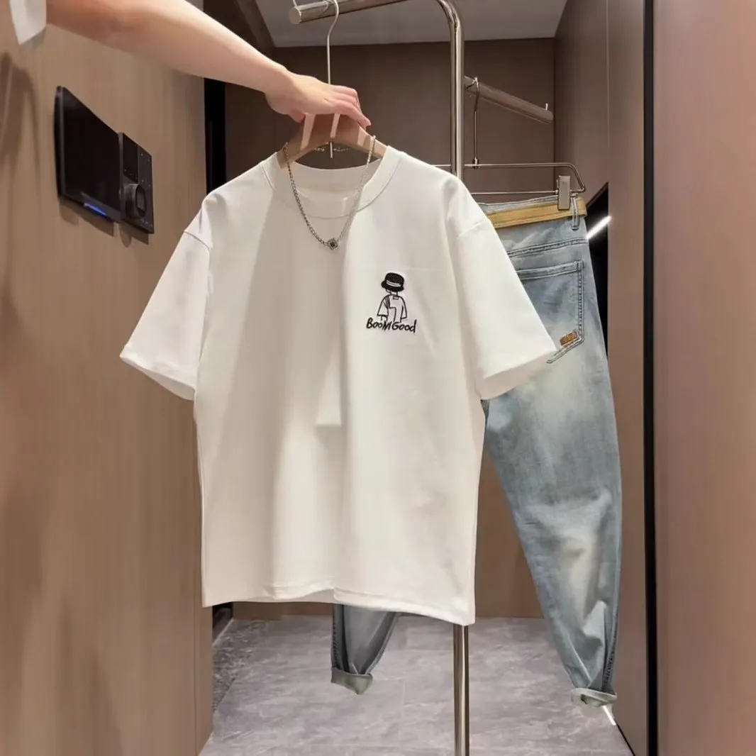 Men's black cotton t-shirt with a cartoon print, showing crew neck and short sleeve design on a hanger.