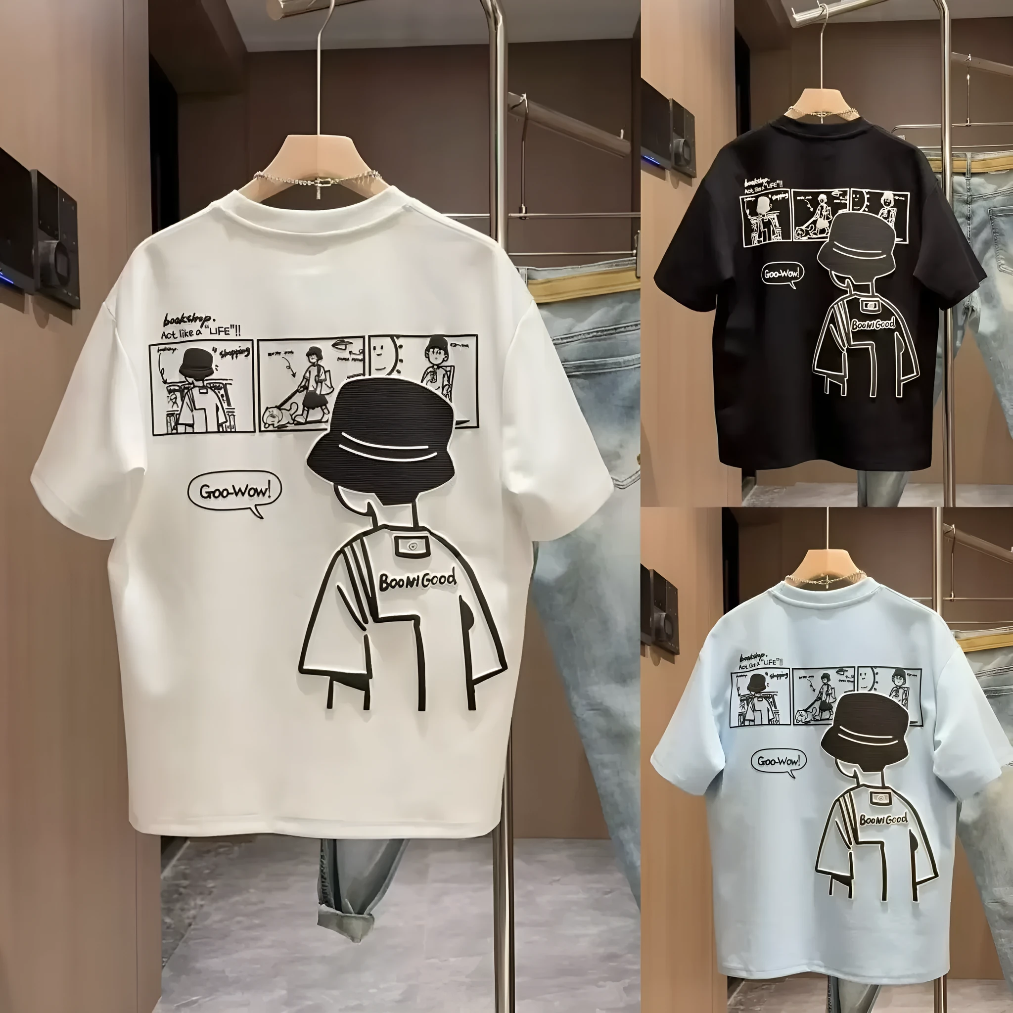 Men's black cotton t-shirt with a cartoon print, showing crew neck and short sleeve design on a hanger.