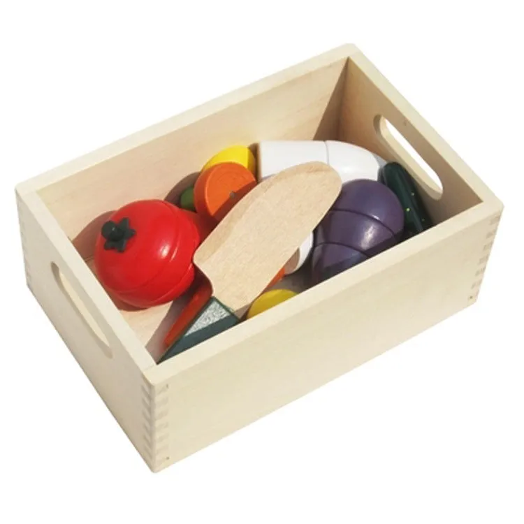 Children's wooden magnetic fruit and vegetable slicer toy on a table