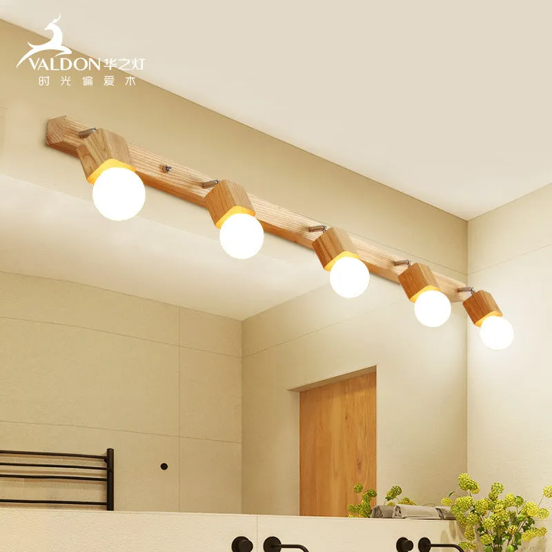 Compact 24cm LED wall lamp with a mirrored cabinet design mounted on a wall.