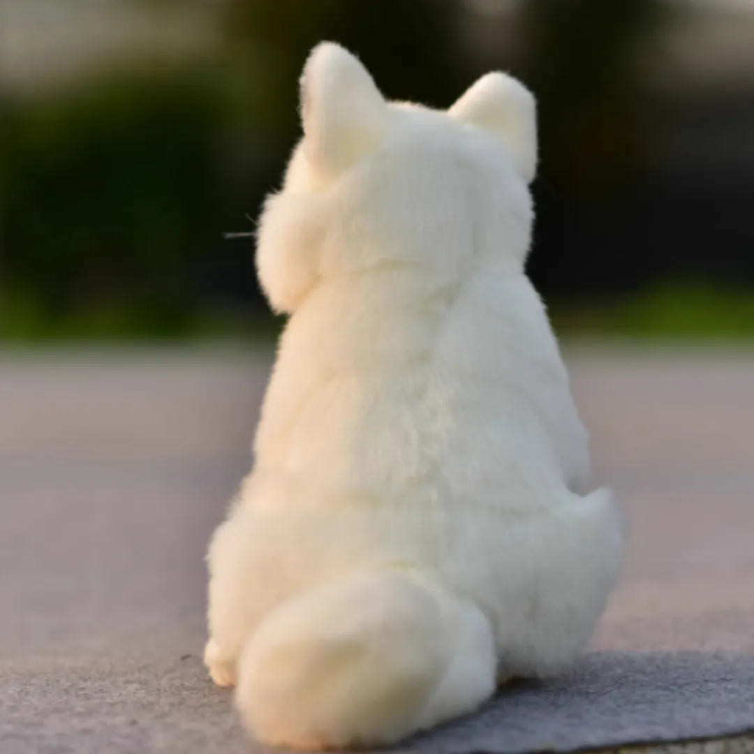 Soft plush toy animal doll approximately 25.5 cm tall in orange red colour, sitting firmly on a white desk surface