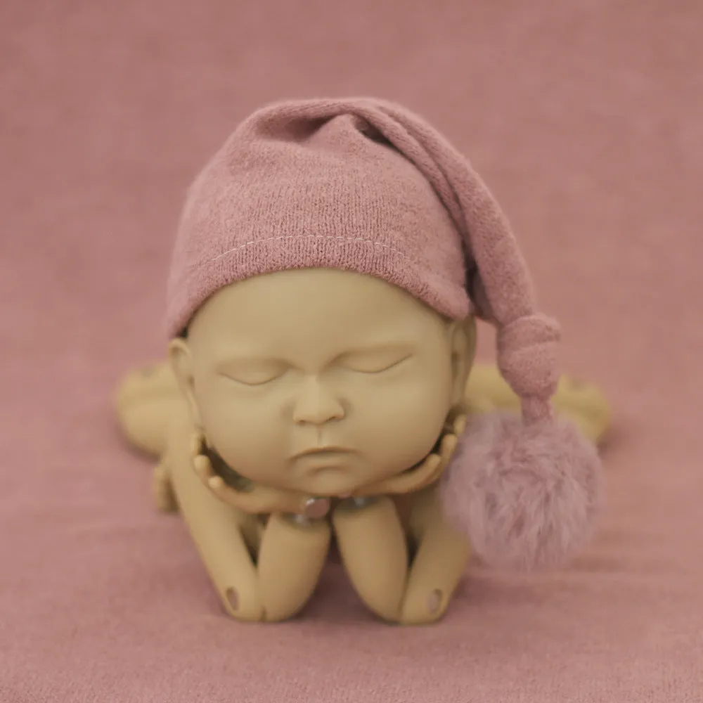 Hand-woven yarn baby photography hat in conical style, available in twelve colour options