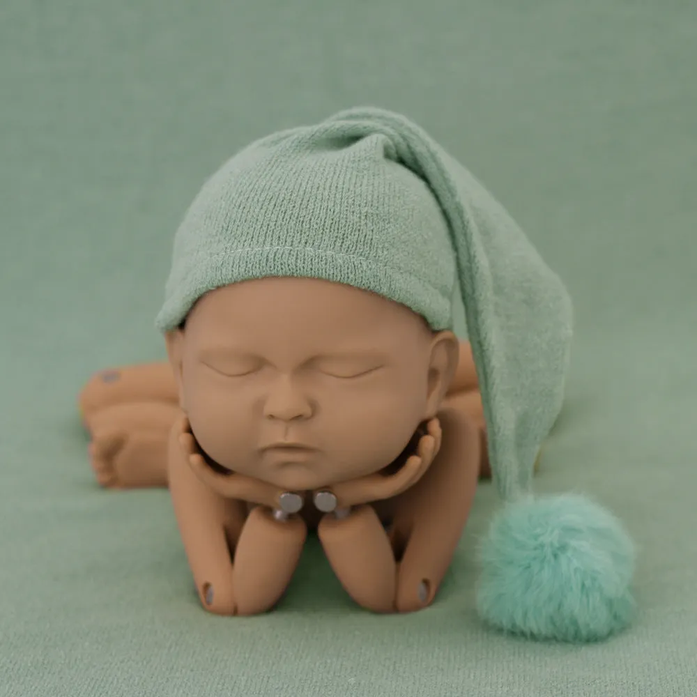 Hand-woven yarn baby photography hat in conical style, available in twelve colour options