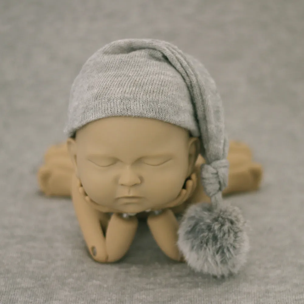 Hand-woven yarn baby photography hat in conical style, available in twelve colour options
