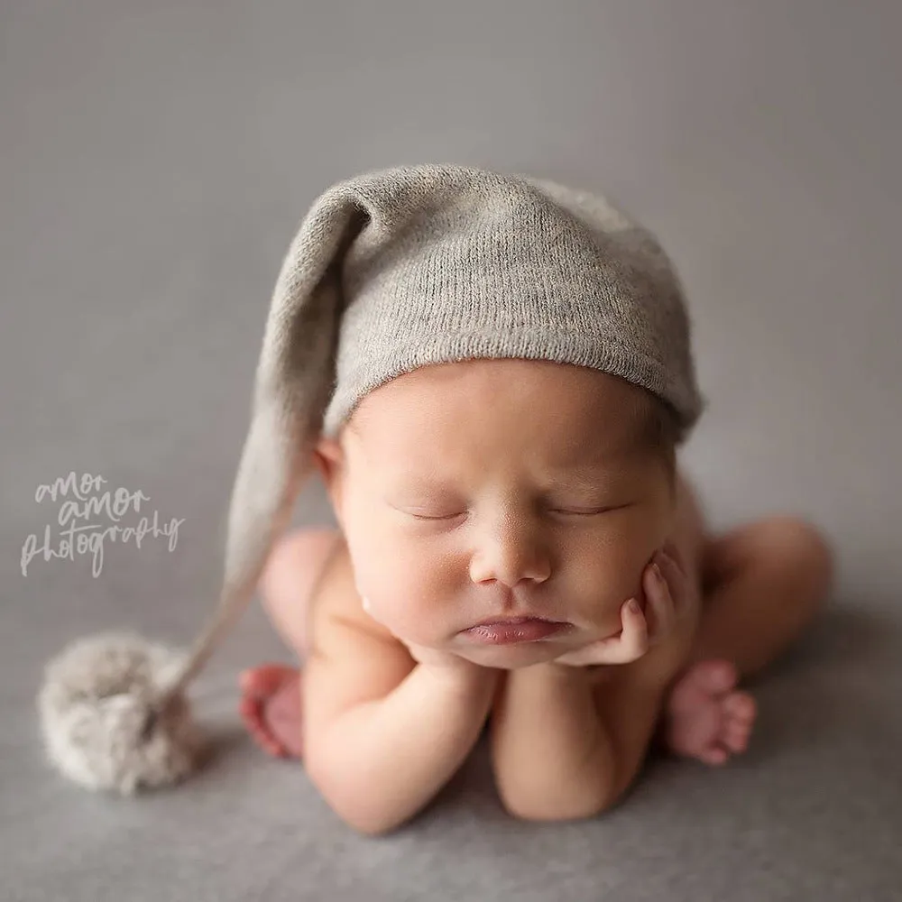 Hand-woven yarn baby photography hat in conical style, available in twelve colour options