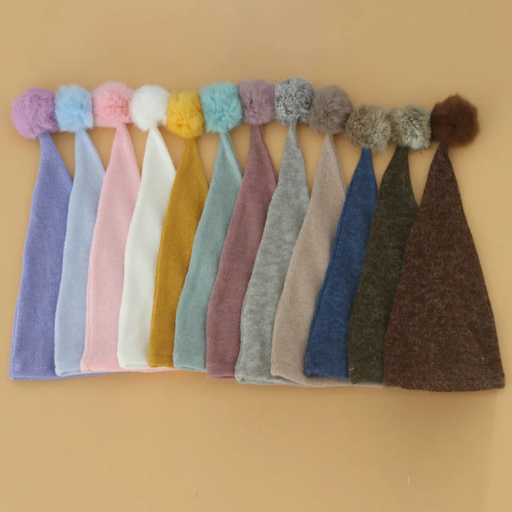 Hand-woven yarn baby photography hat in conical style, available in twelve colour options