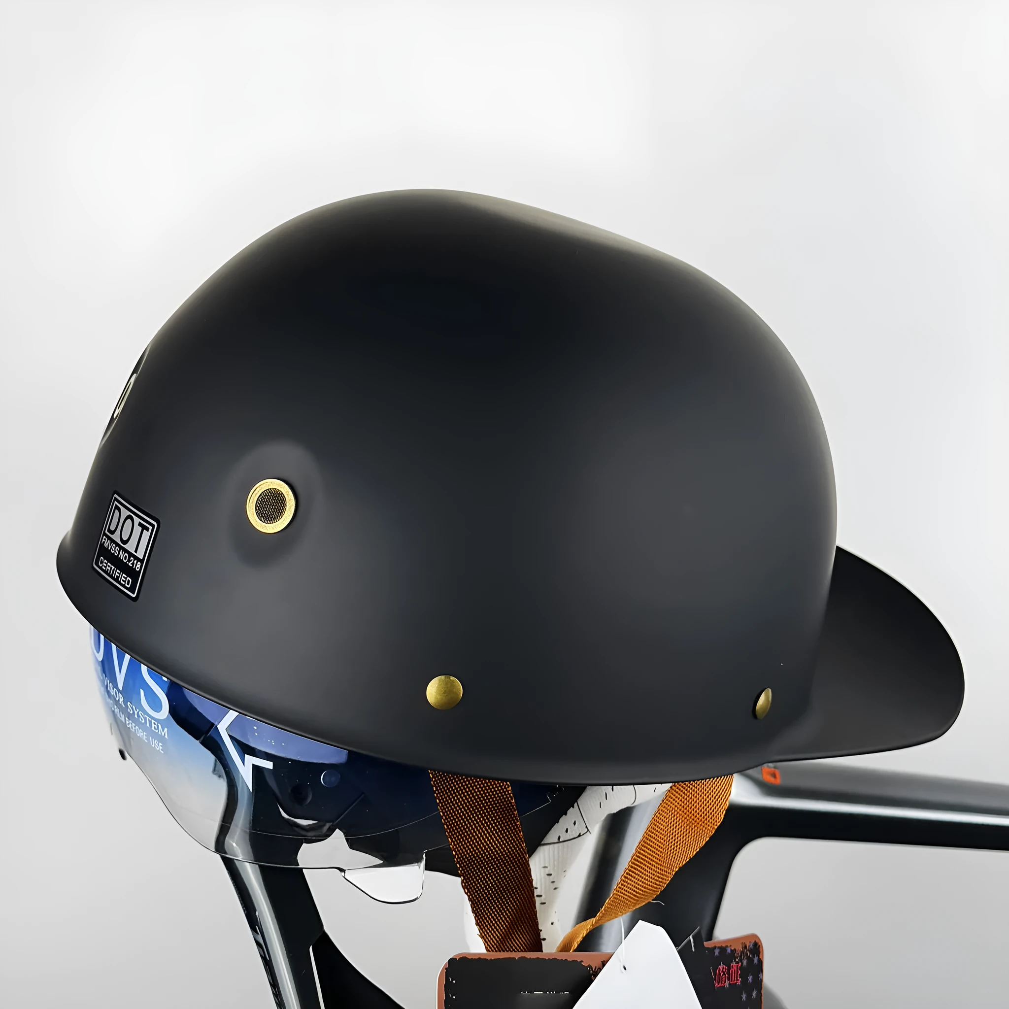 ABS motorcycle helmet in Black Feather design with blue lens visor, side view