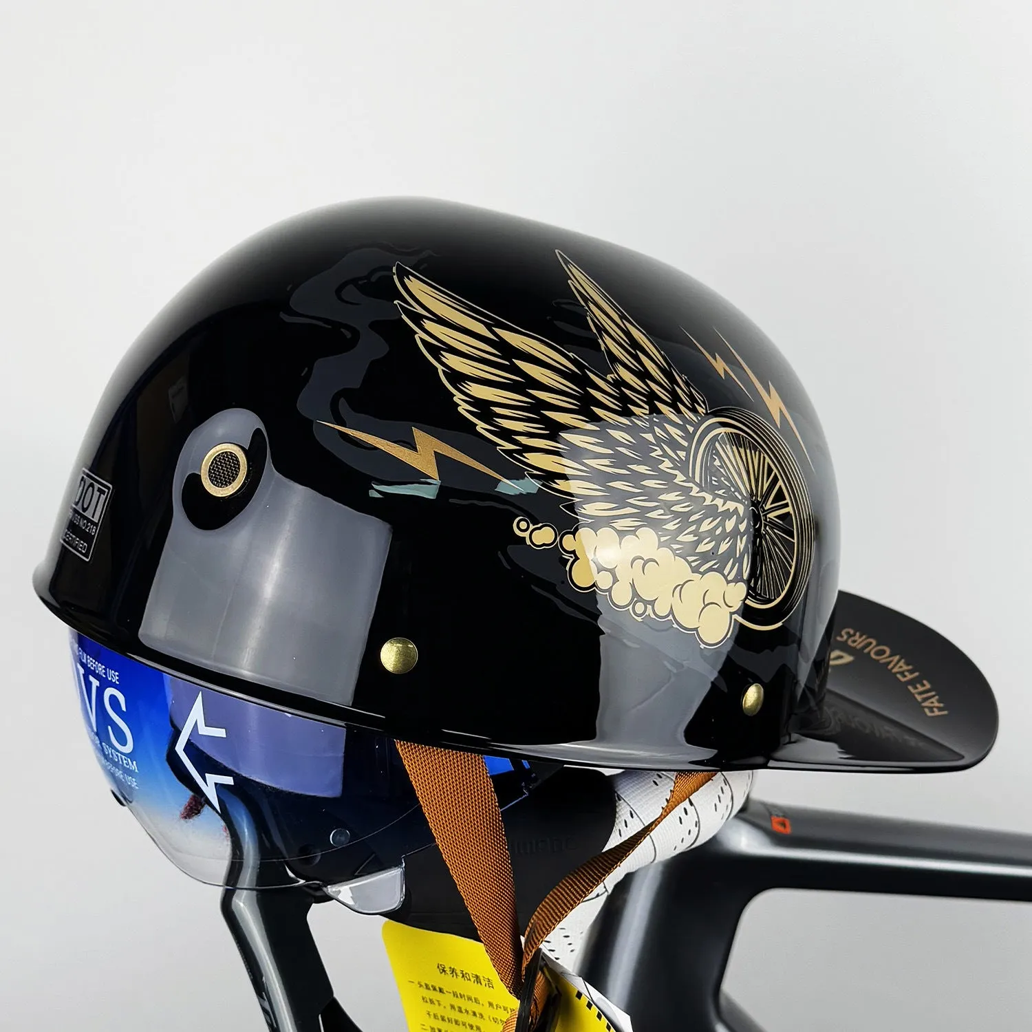 ABS motorcycle helmet in Black Feather design with blue lens visor, side view