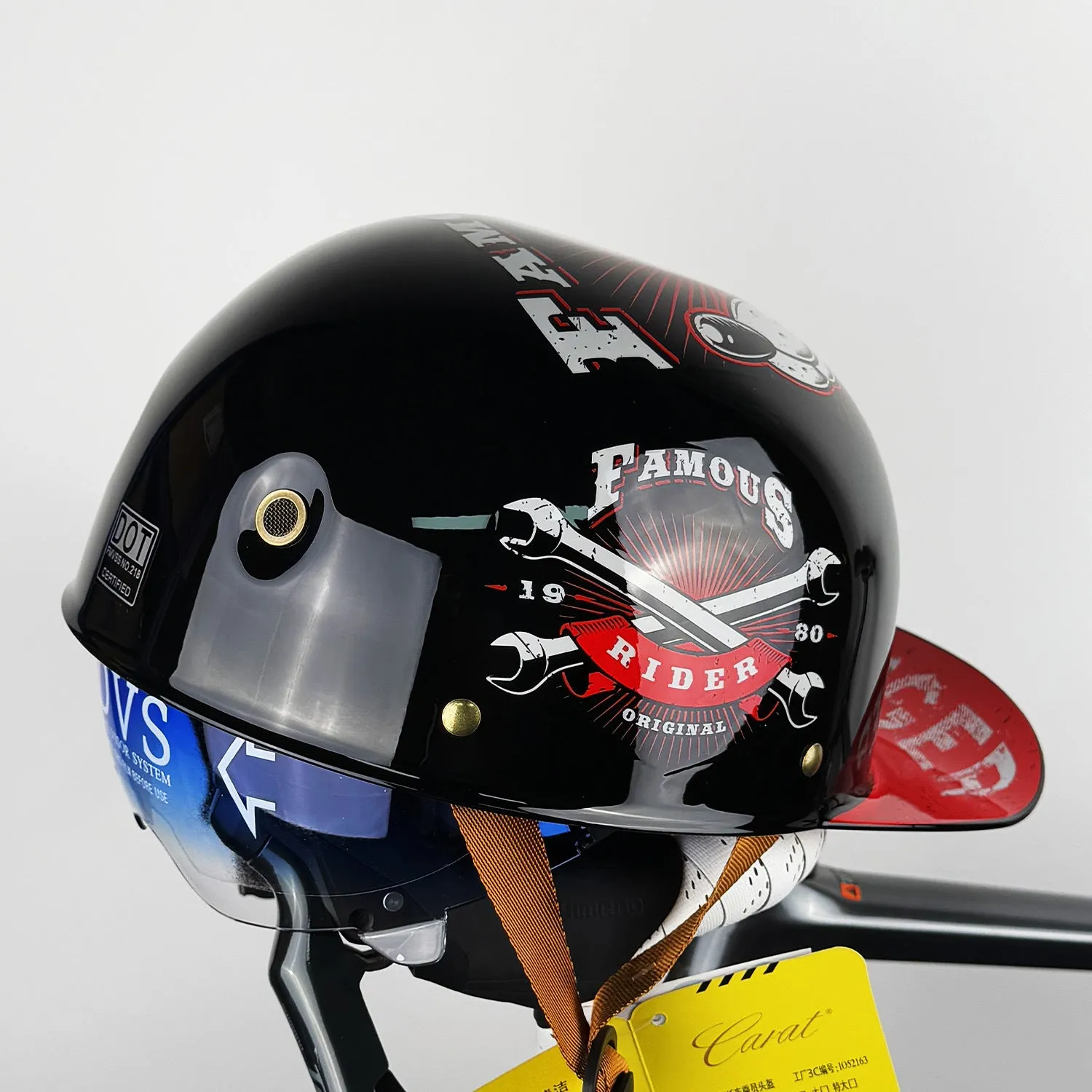 ABS motorcycle helmet in Black Feather design with blue lens visor, side view