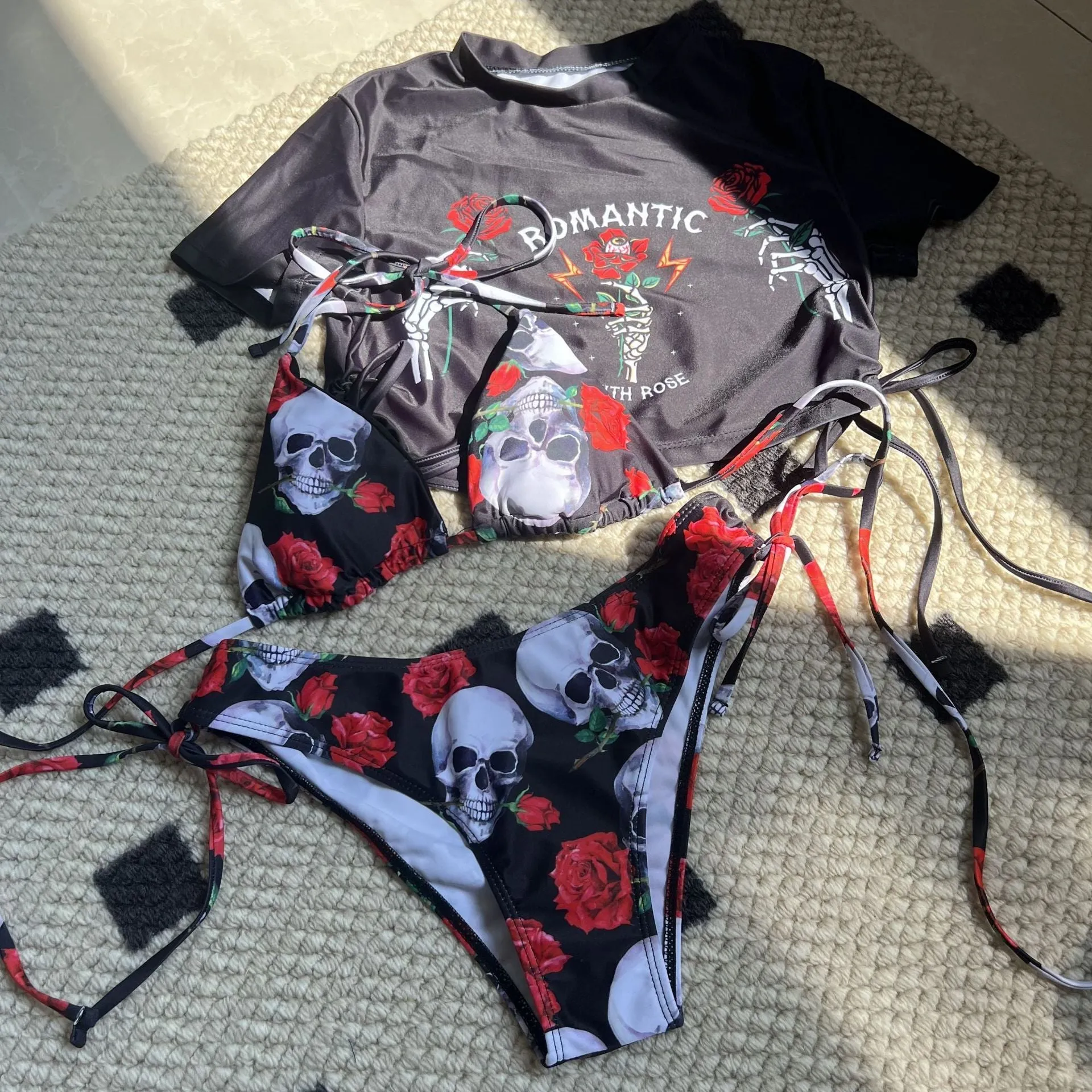Women's three-piece swimsuit set with skull and rose printed design in red colour