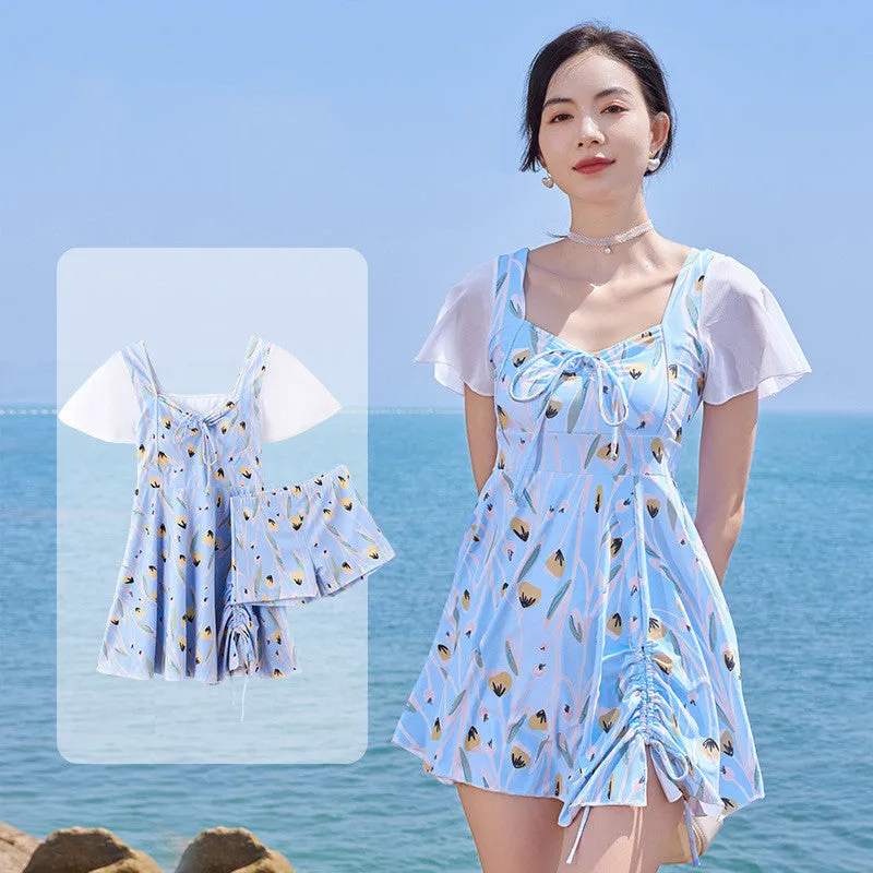 Sea salt blue floral pattern women's one-piece swimsuit on a hanger
