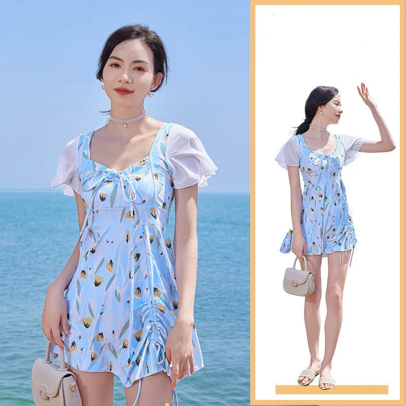 Sea salt blue floral pattern women's one-piece swimsuit on a hanger