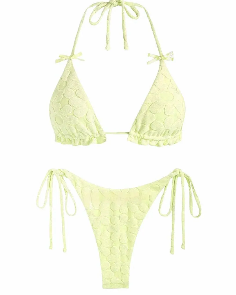 Women's light blue backless bikini swimsuit with strappy design on a mannequin.