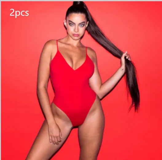 Backless one-piece swimsuit for women with string sides in a solid colour.
