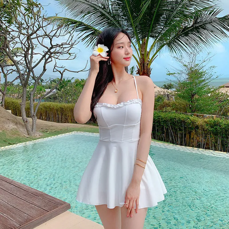 White women's one-piece swimsuit with hollow-out design on mannequin