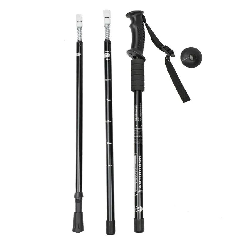 Aluminium telescopic trekking poles with multiple tip accessories in black, blue, silver, or red.