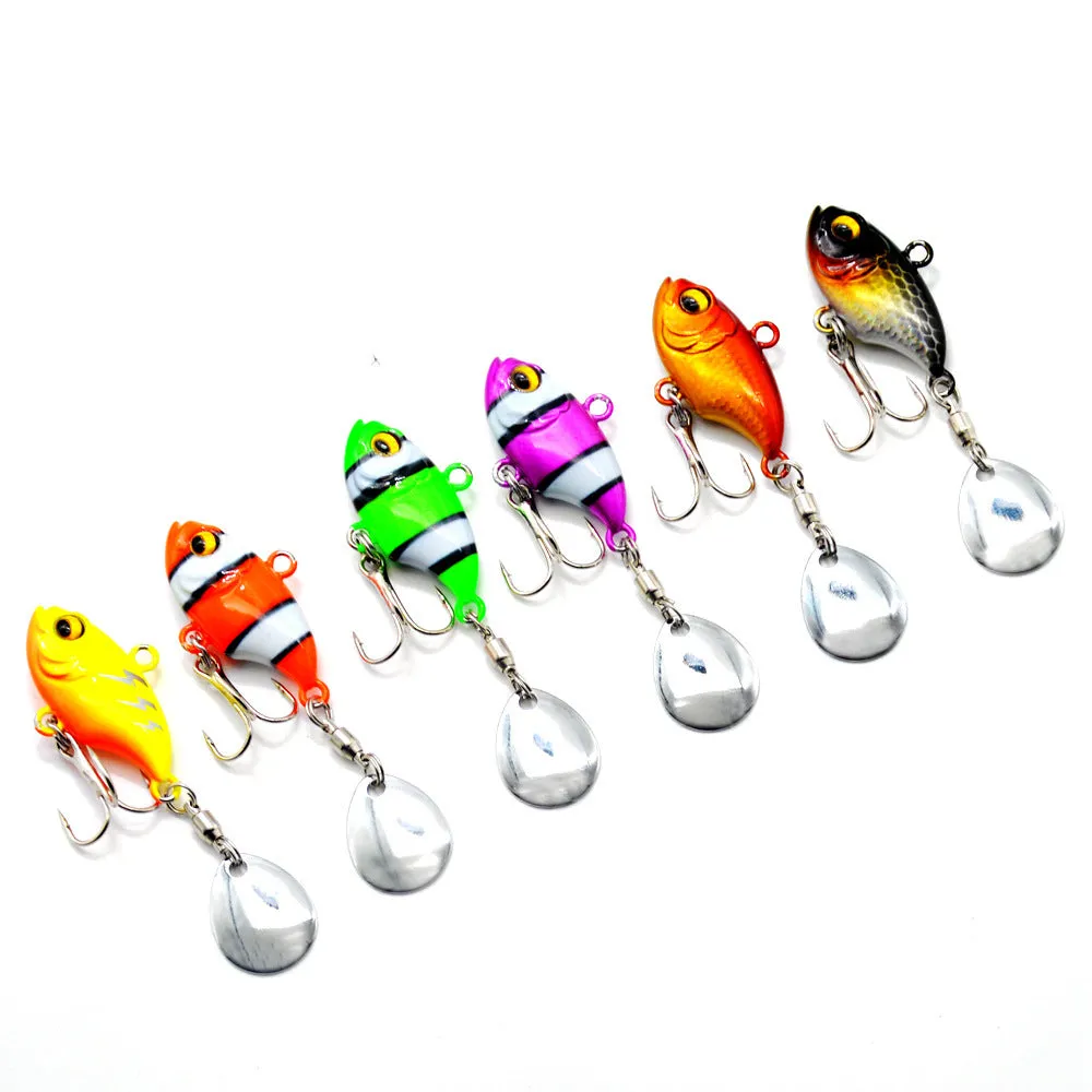 Metal fishing lure with rotating sequins in zebra orange colour pattern.