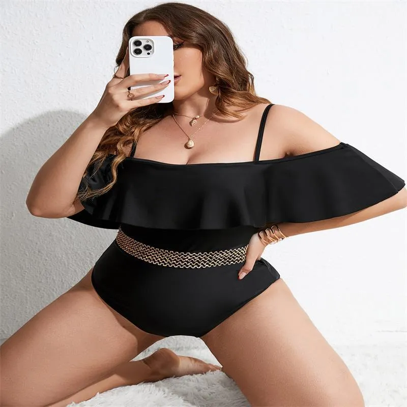 Black women's one-piece swimsuit on hanger showing front and back views