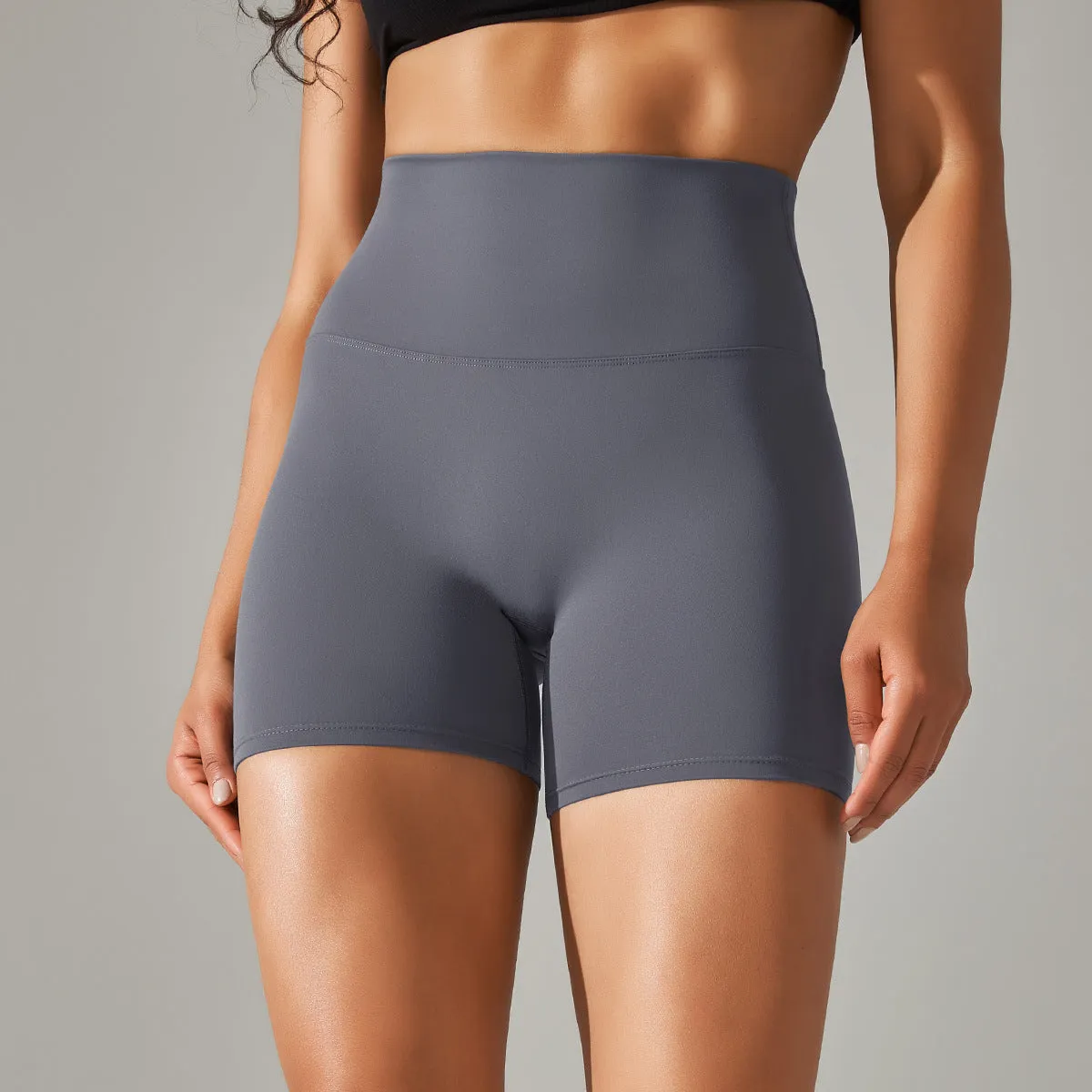 Women's high waist fitness tights in dark green, hip-length cut, for running and gym wear.