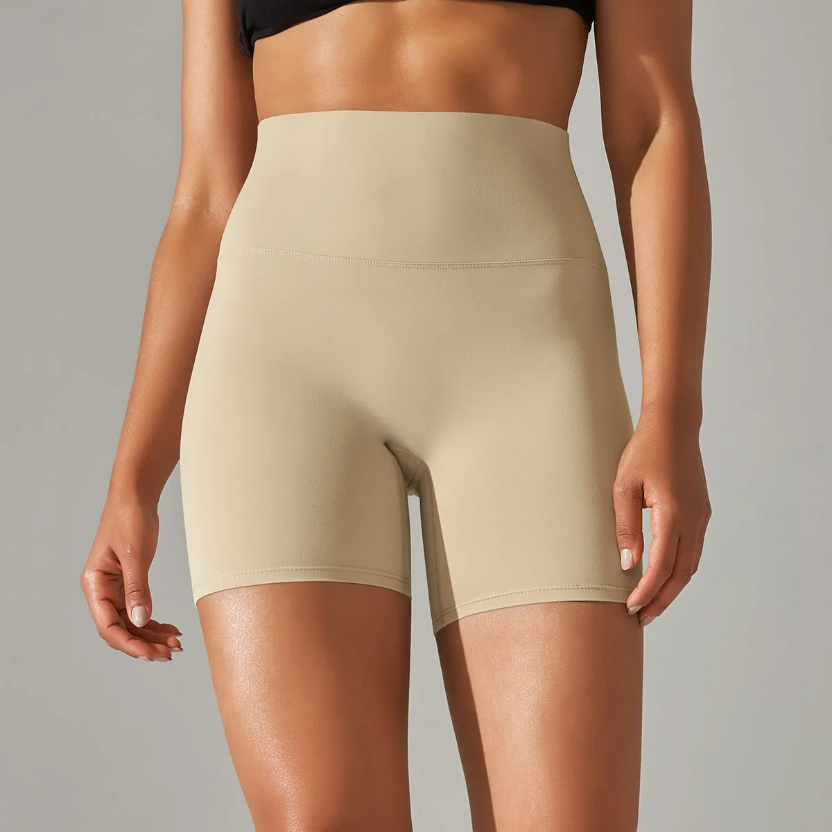 Women's high waist fitness tights in dark green, hip-length cut, for running and gym wear.