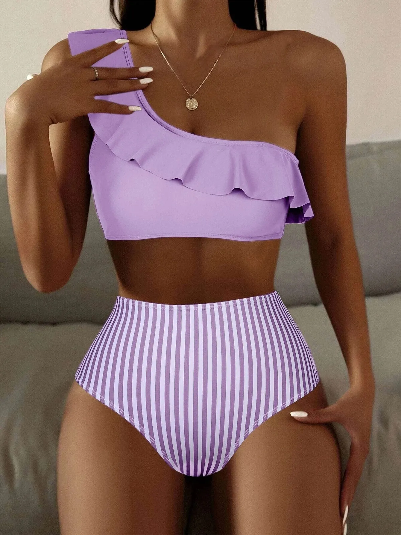 Women's striped and solid colour bikini swimsuit set on a white background.