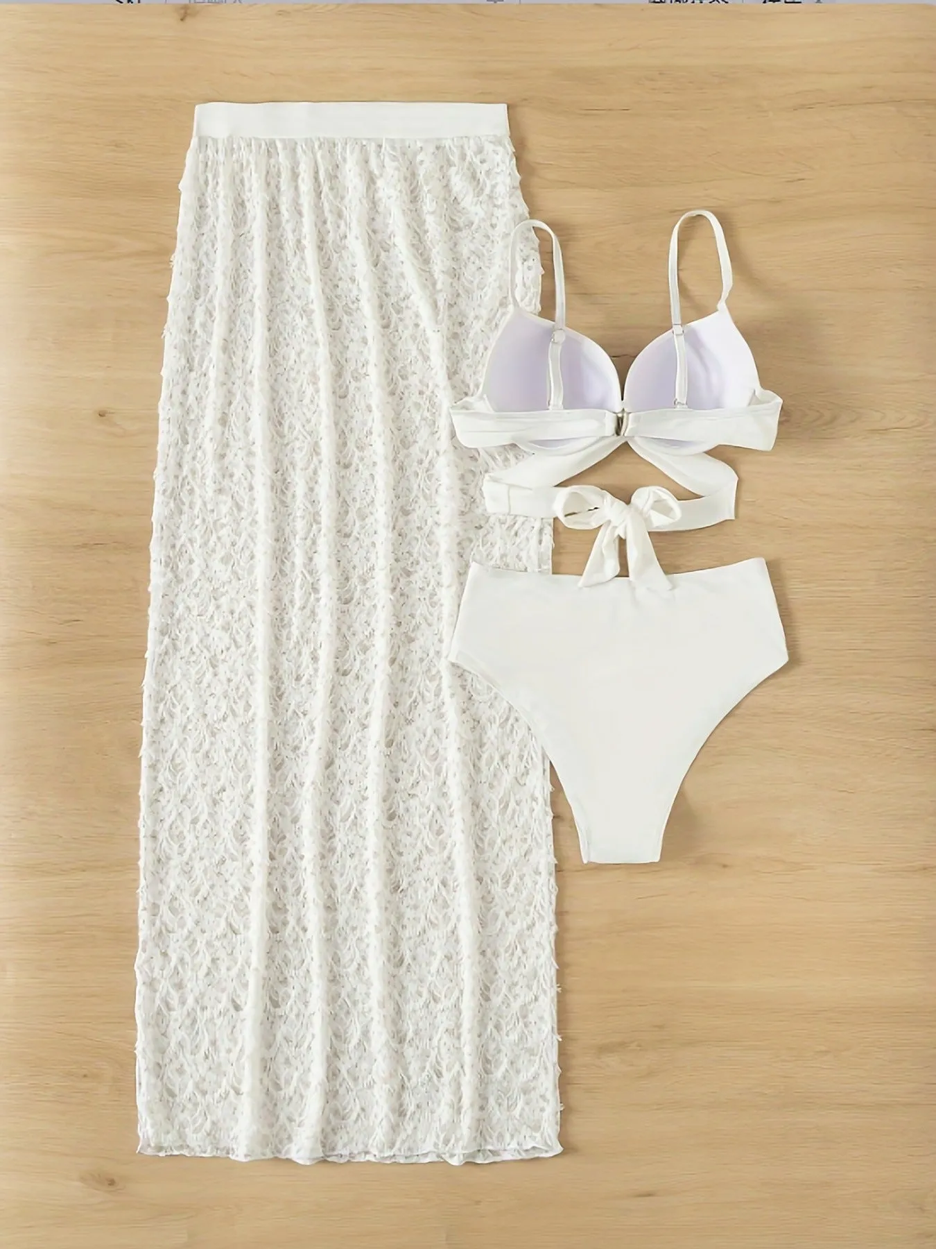 White nylon three-piece swimsuit set with bikini top, briefs, and a long gathered skirt.