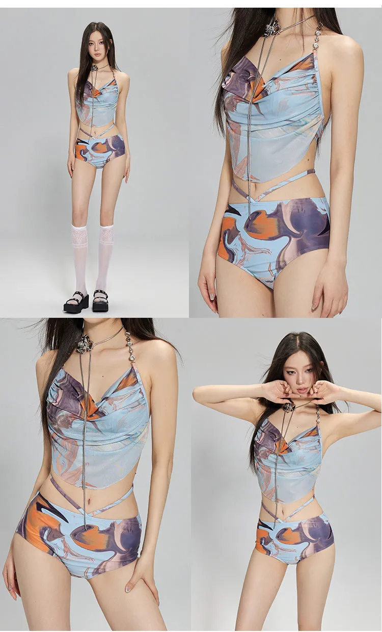Women's blue printed three-piece bikini set with triangle top featuring steel wire support and a detachable skirt.