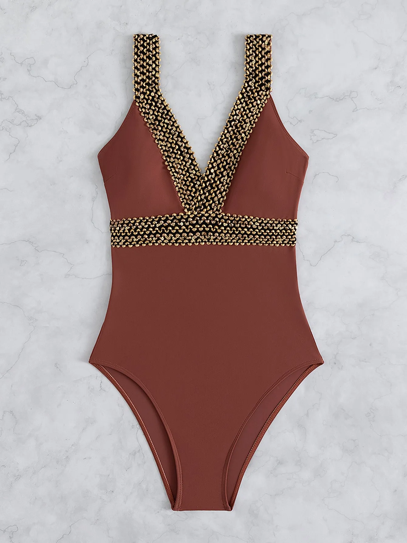 Women's deep V-neck one-piece swimsuit with spaghetti straps in a printed pattern