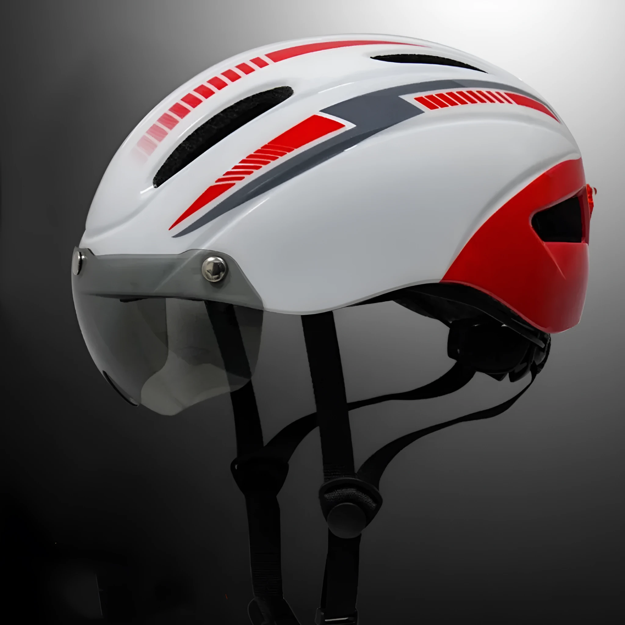 Adult bicycle helmet with integrated rear red taillight shown in a black and blue colour variant.