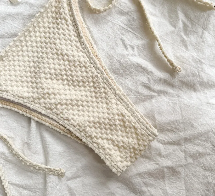 Women's halter lace-up bikini swimsuit in milky white with adjustable side ties