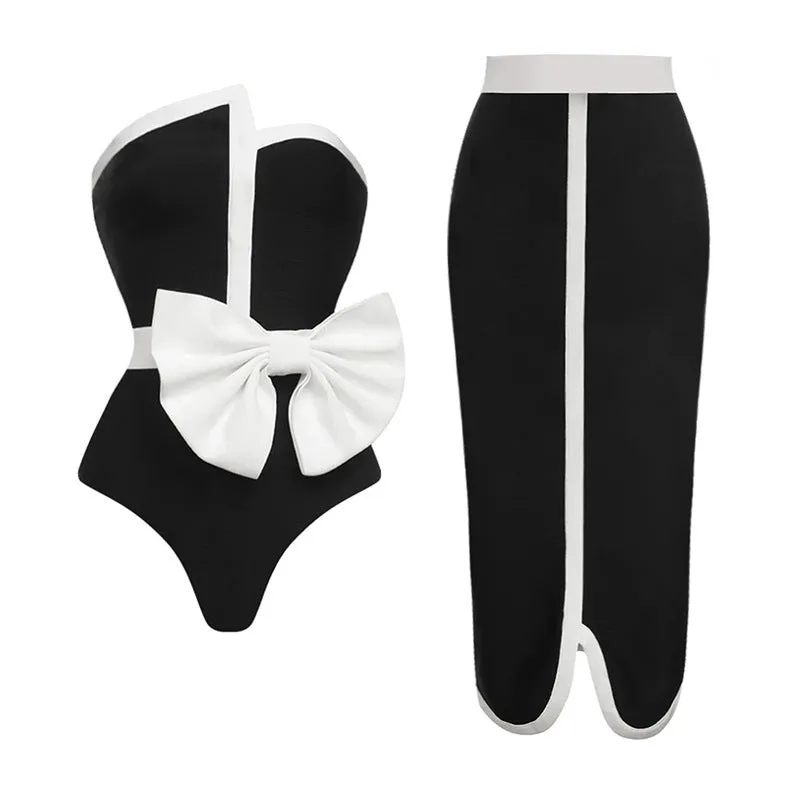 Women's black and white colour-block one-piece swimsuit with bow detail and tube top neckline