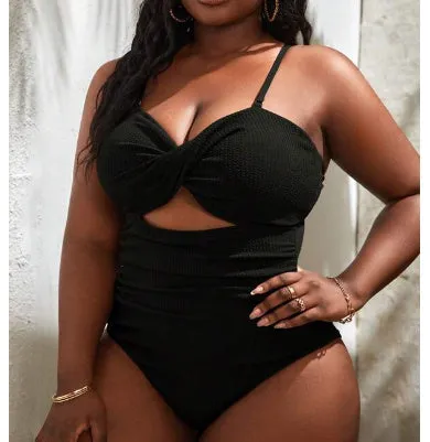 Black plus size one-piece swimsuit for women with sleeveless design and solid colour