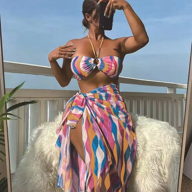Women's three-piece printed swimsuit set with beach skirt in magenta colour