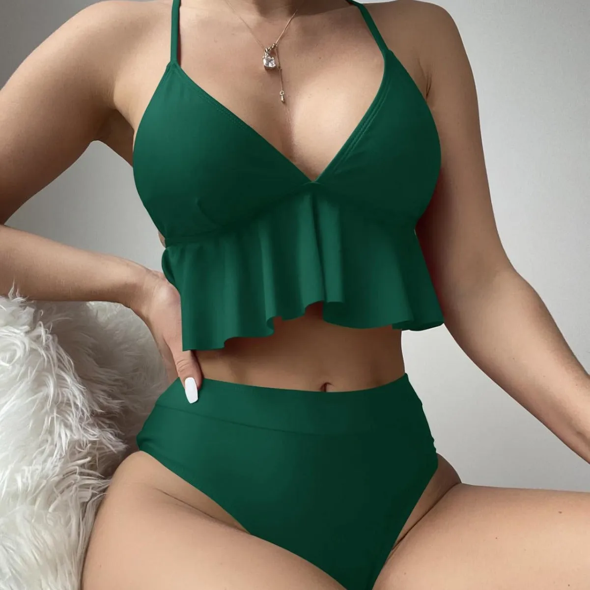 Women's solid colour bikini swimsuit in black, army green, brick red, or blue.
