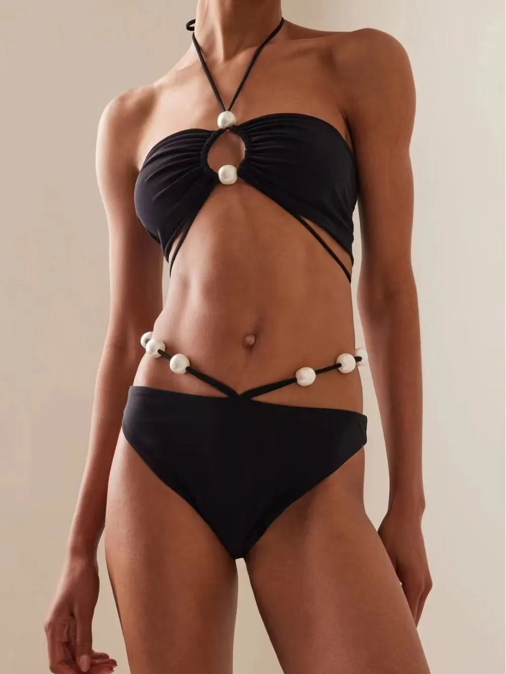 Women's black lace-up bikini swimsuit with adjustable ties and quick-dry fabric