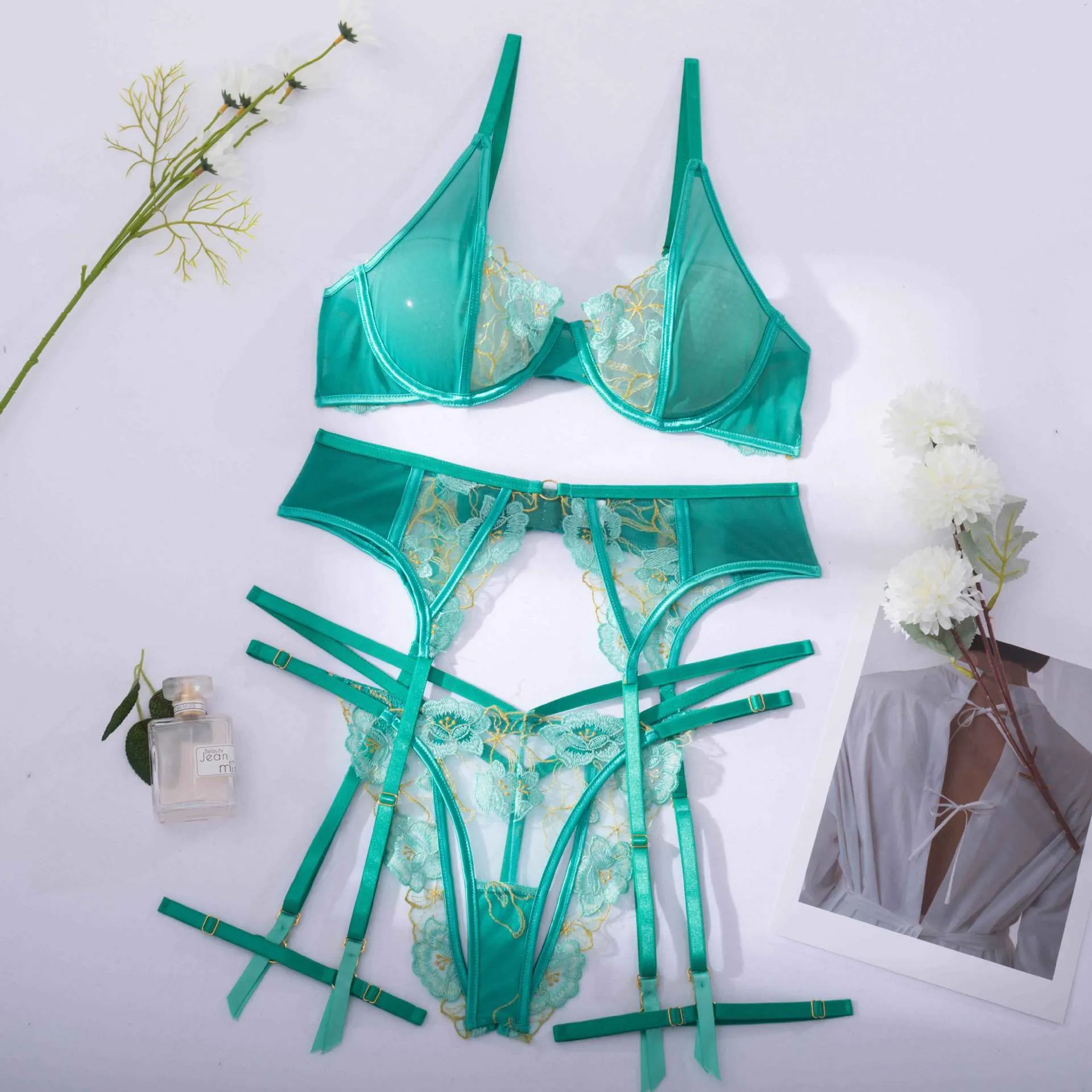 Light green embroidered women's bra and bikini set in three-point style.