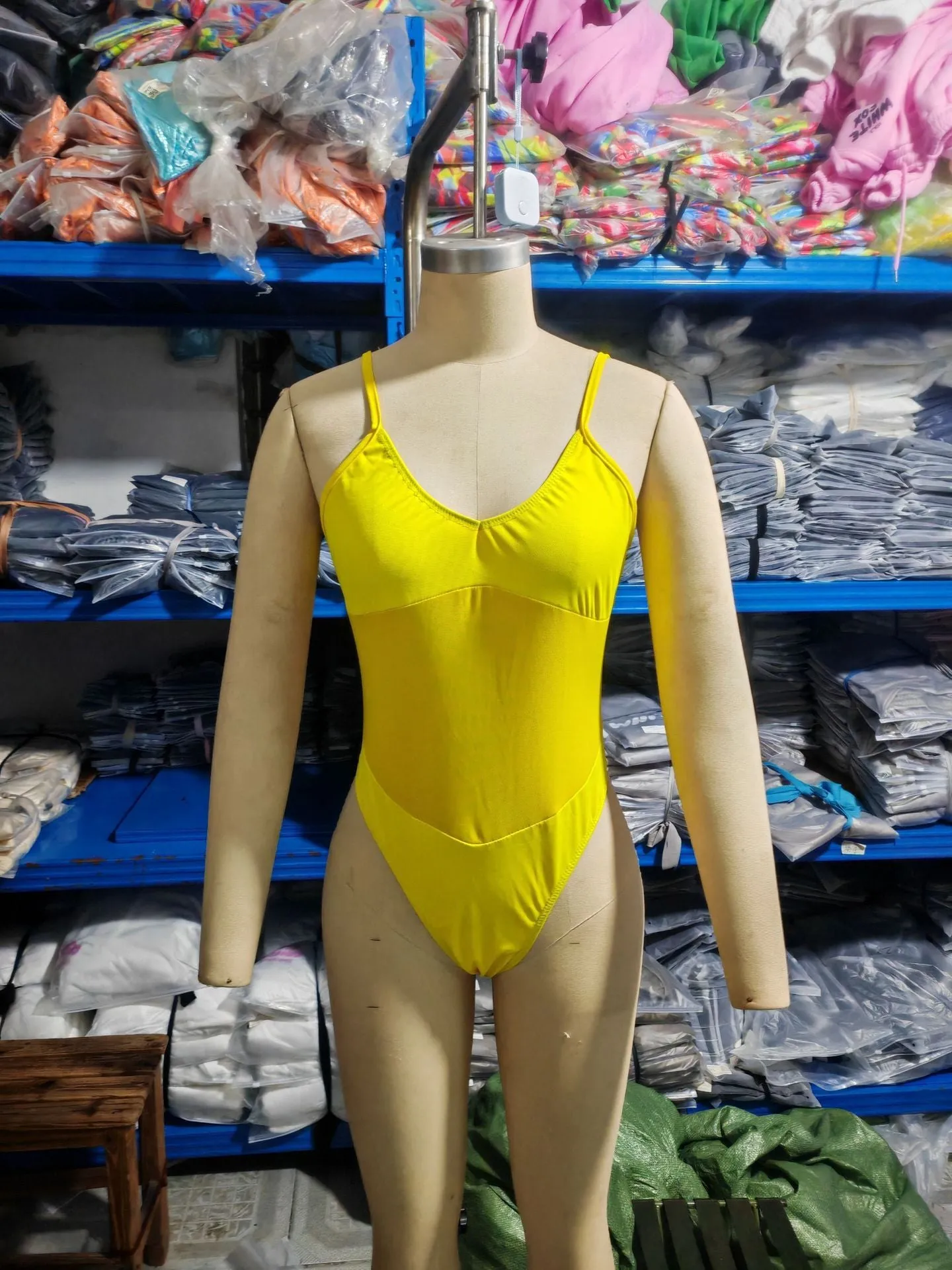Black banded bikini style one-piece swimsuit for women on a mannequin